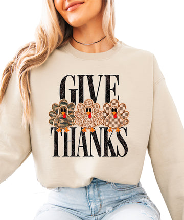 Give Thanks Thanksgiving sweatshirt for women in Sand with camo, leopard and checkered turkeys