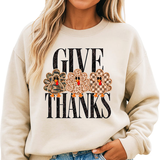 Give Thanks Thanksgiving sweatshirt for women in Sand with camo, leopard and checkered turkeys