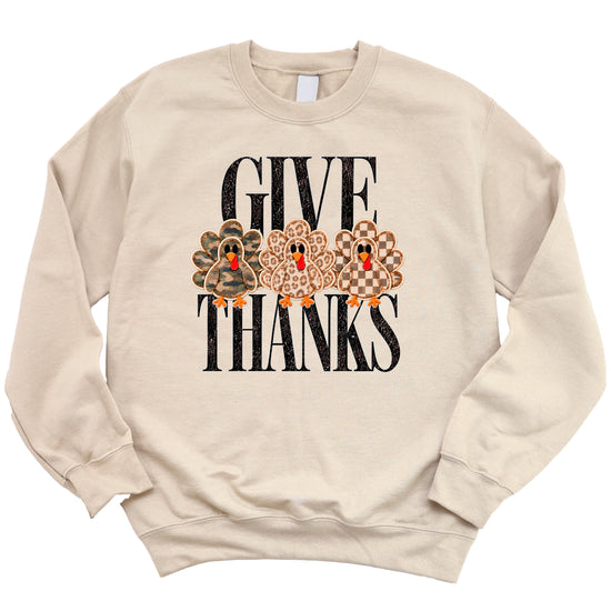 Give Thanks Thanksgiving sweatshirt for women in Sand with camo, leopard and checkered turkeys