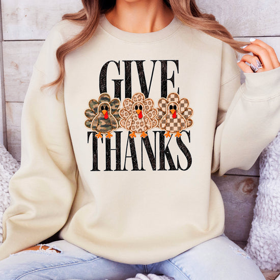 Give Thanks Thanksgiving sweatshirt for women in Sand with camo, leopard and checkered turkeys