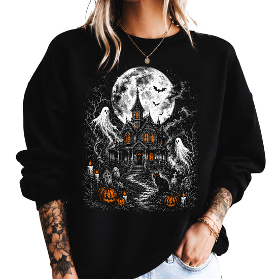 Black crewneck sweatshirt with vintage haunted house, ghosts and jack-o-lantern Halloween graphic, front view