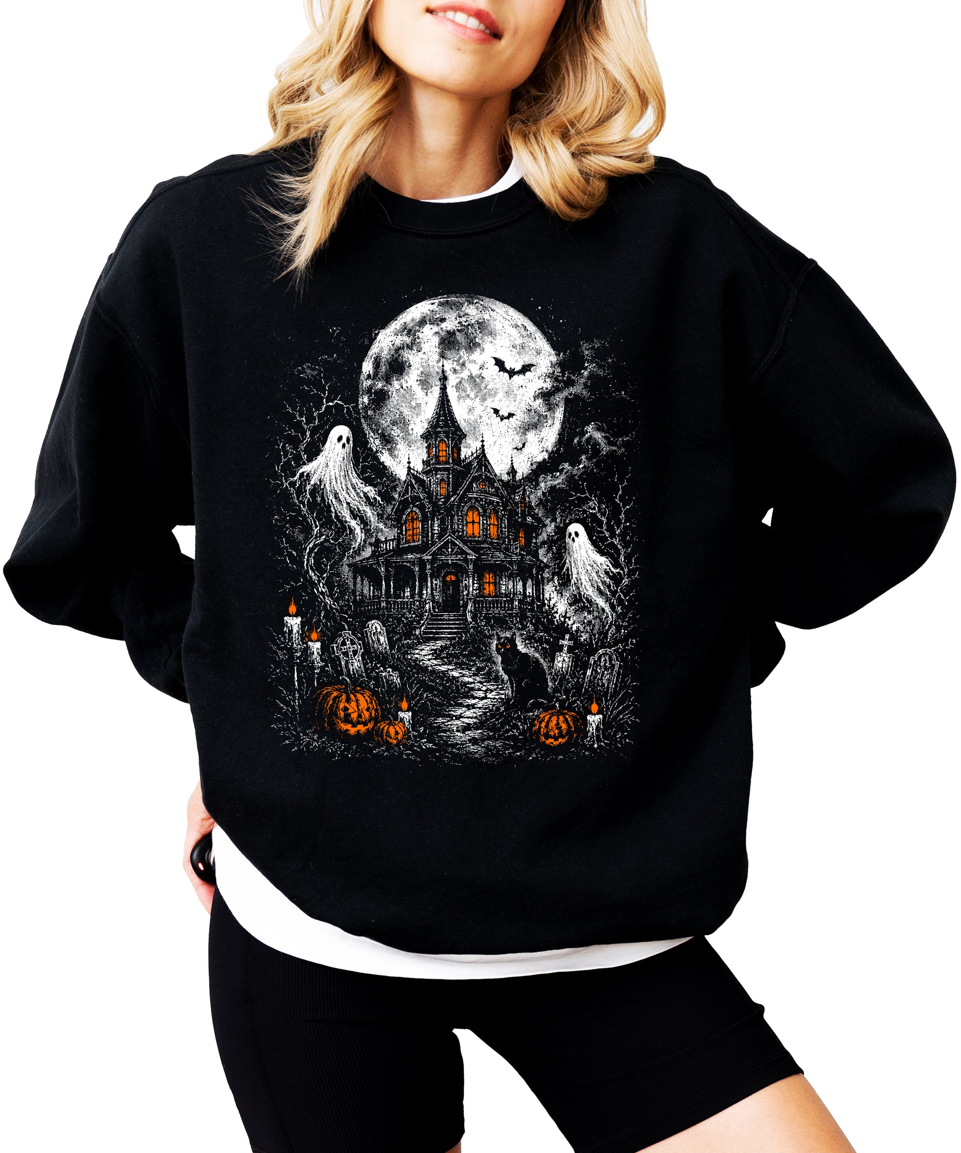 Moonlit graveyard and haunted house print detail on black Halloween crewneck sweatshirt