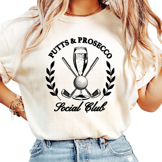 Putts and Prosecco Social Club golf t-shirt for women in Ivory, front view