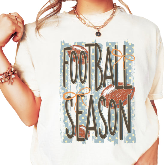 Football Season coquette bow Comfort Colors tee in Ivory - front view