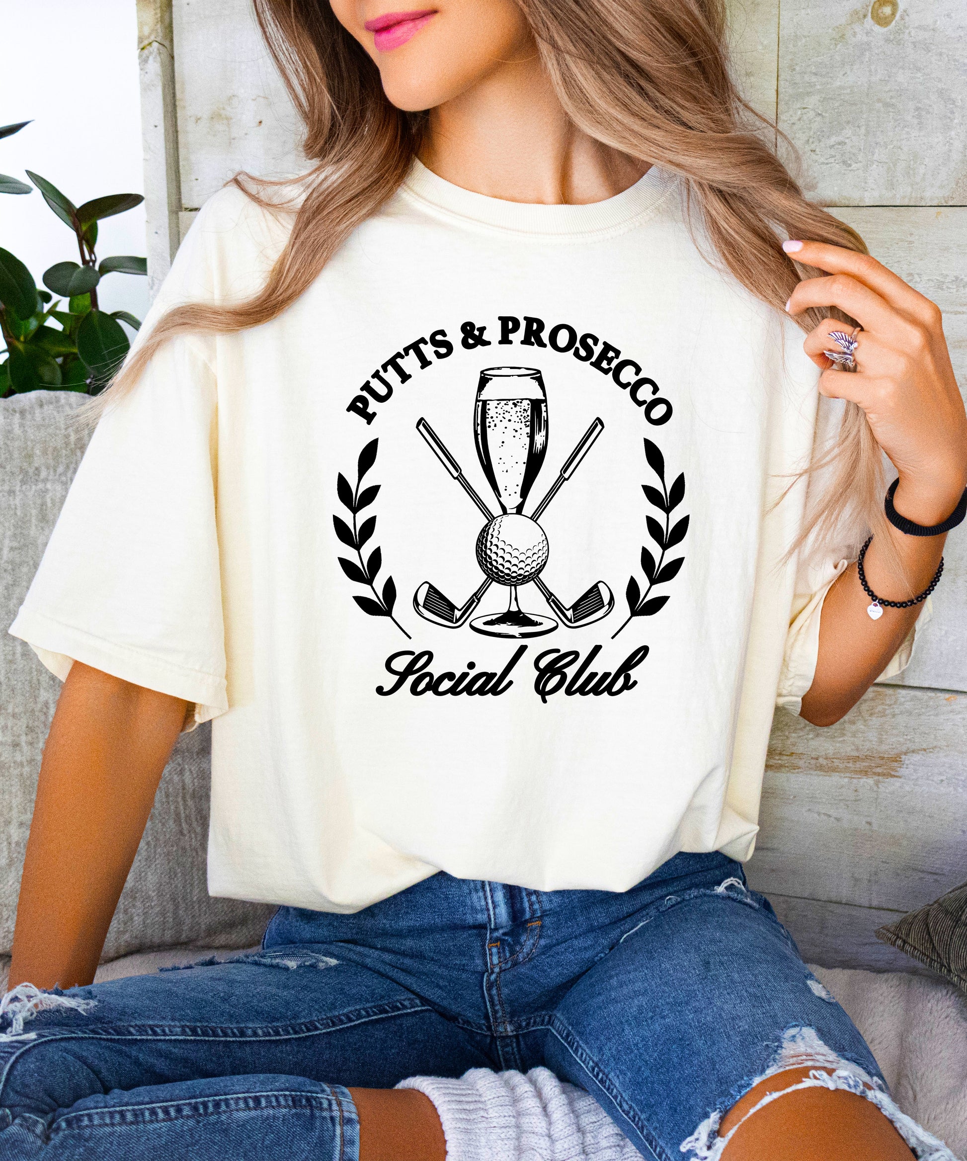 Putts and Prosecco Social Club womens golf tee in Ivory, lifestyle view