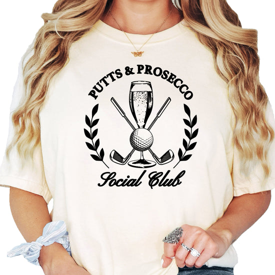 Putts and Prosecco Social Club womens golf tee in Ivory, back view