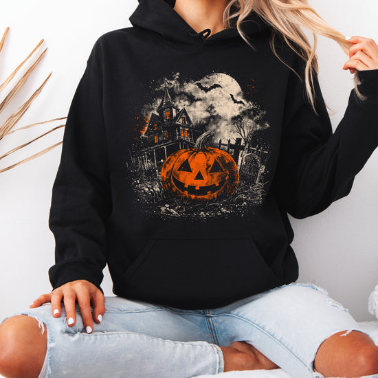 Jack O Lantern haunted house Halloween hoodie in Black - styled with jeans
