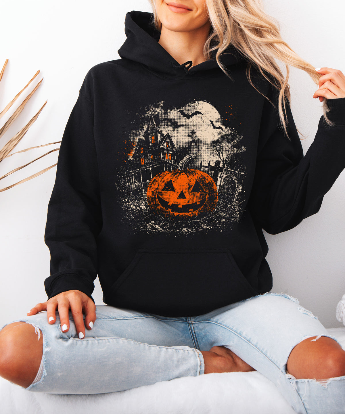 Jack O Lantern haunted house Halloween hoodie in Black - styled with jeans
