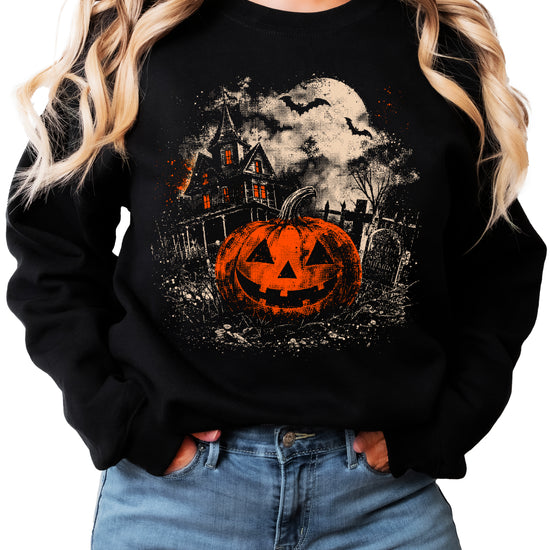 Jack o lantern pumpkin and moonlit graveyard print detail on black Halloween crewneck sweatshirt