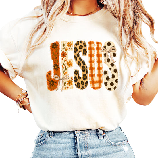 Jesus floral leopard bow Christian Easter graphic tee in Ivory, front view