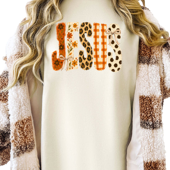 Jesus floral leopard bow Christian Easter graphic tee in Ivory, detail view