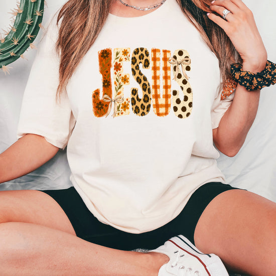 Jesus floral leopard bow Christian Easter graphic tee in Ivory, lifestyle view