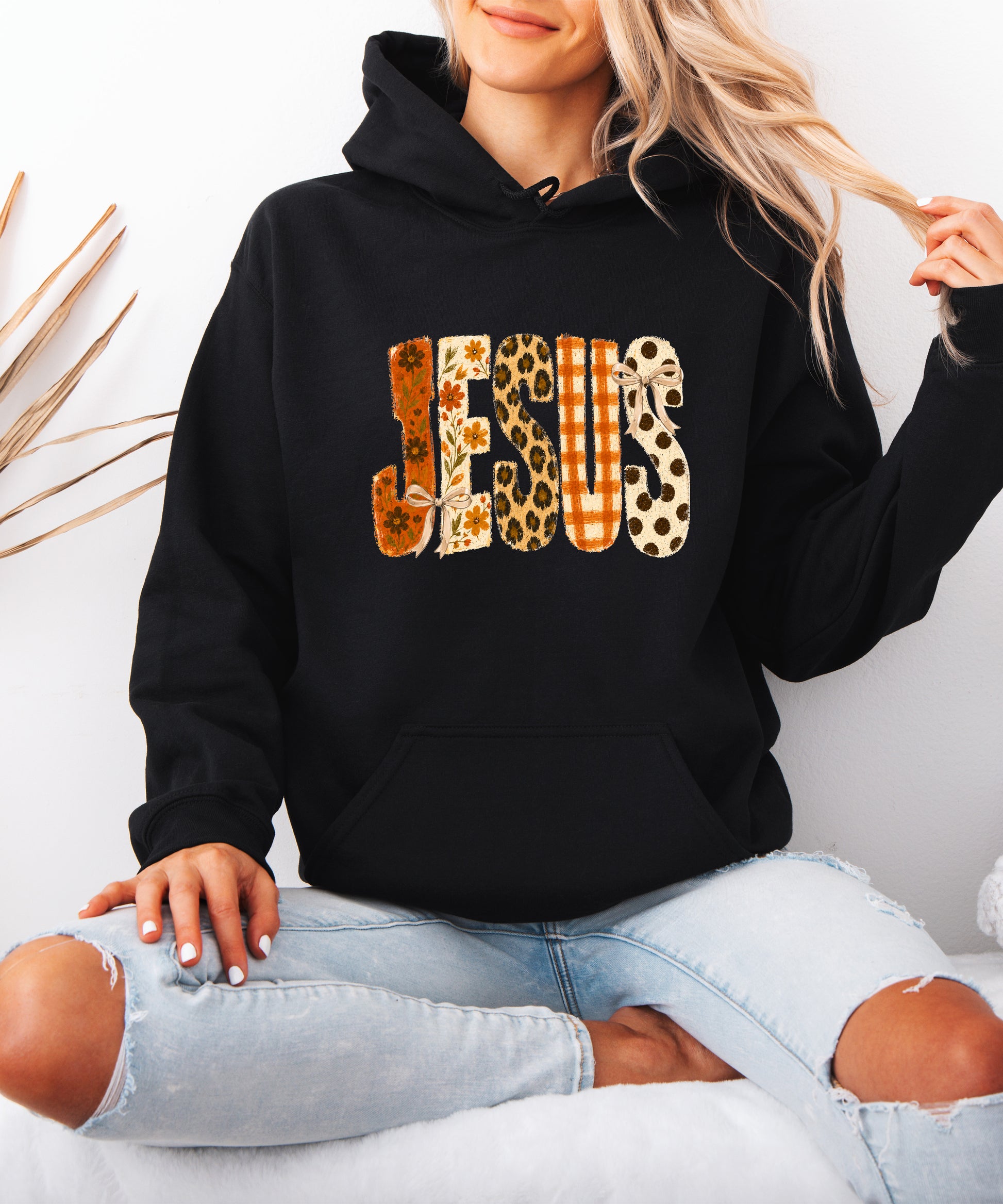 Jesus floral leopard coquette bow Christian hoodie in Black, model view