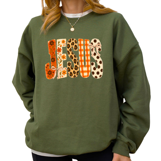 Army Green Jesus fall floral sweatshirt, close up of lettering detail
