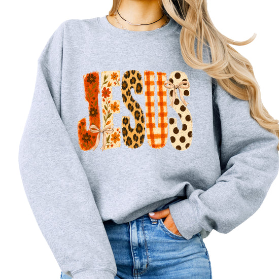 Gray Jesus fall floral sweatshirt, close up of lettering detail