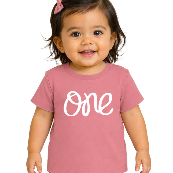 One first birthday shirt for baby girls in White on Mauve