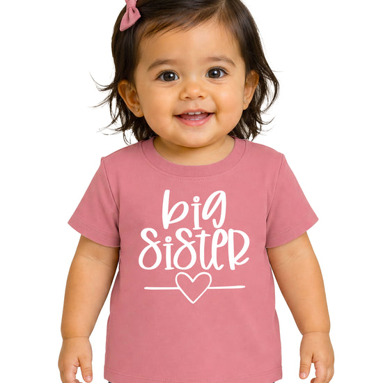 Big Sister heart sibling reveal t-shirt in white on mauve, main view