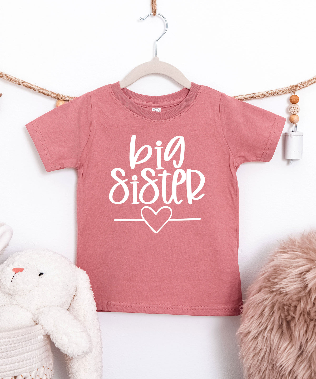 Big Sister heart sibling reveal t-shirt in white on mauve, second view