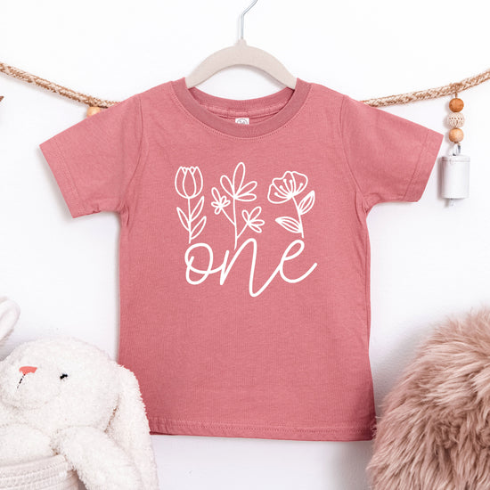 Floral One first birthday shirt for baby girls in white on mauve, second view