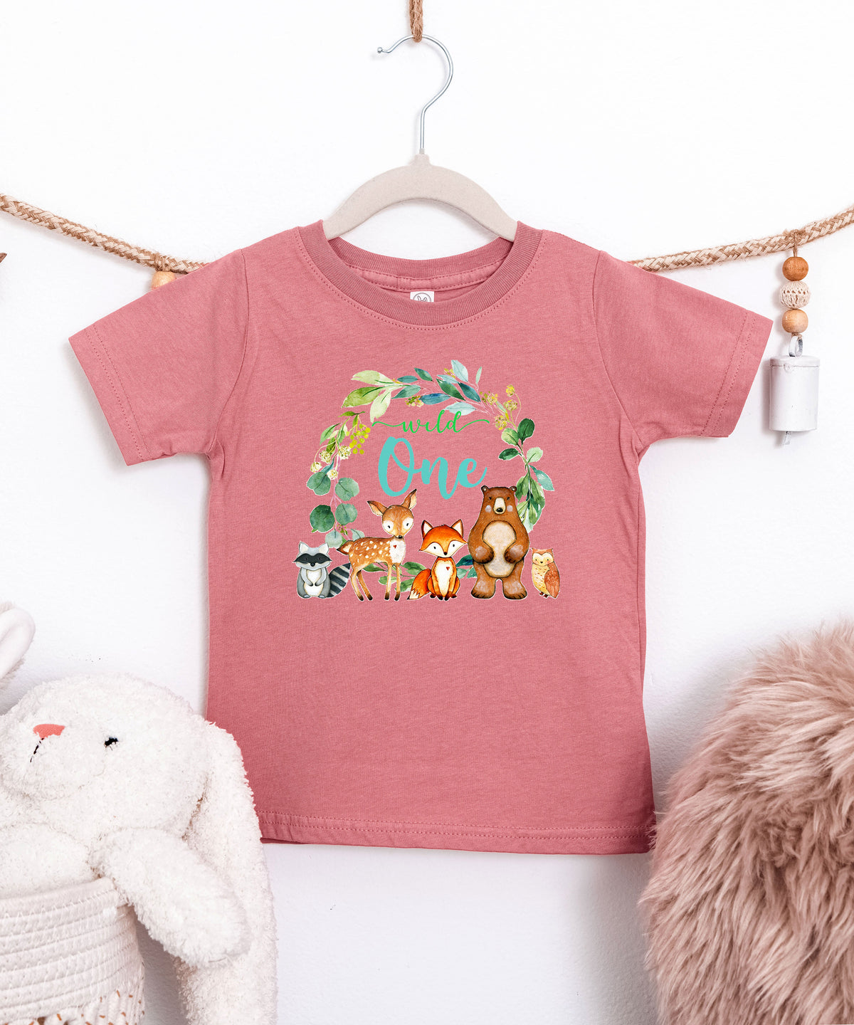 Mauve Wild One wreath first birthday tee flat lay front view