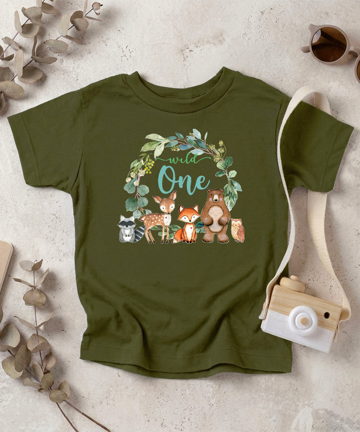 Military green Wild One wreath first birthday tee flat lay front view