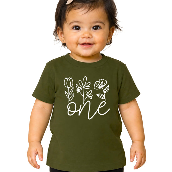 Floral One first birthday shirt for baby girls in white on military green, front view