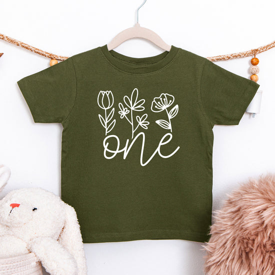 Floral One first birthday shirt for baby girls in white on military green, second view