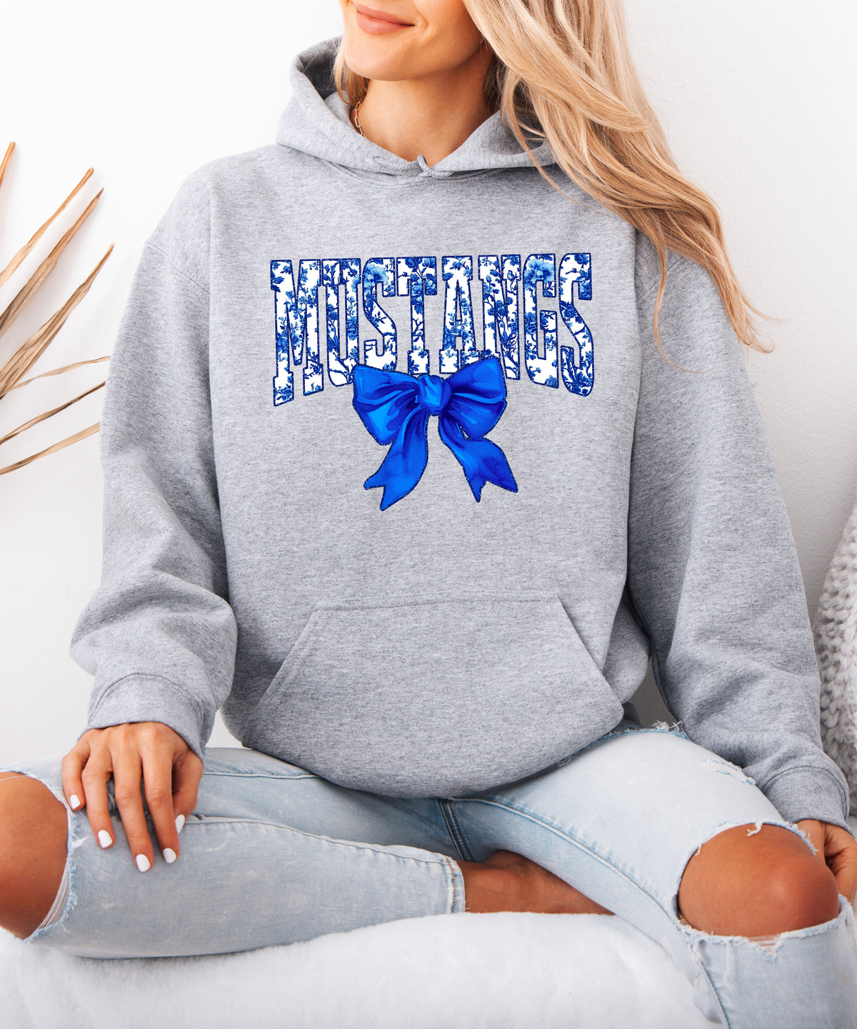 Mustangs floral bow hoodie for women in gray, varsity MUSTANGS letters with blue and white floral print and royal blue bow, image 4