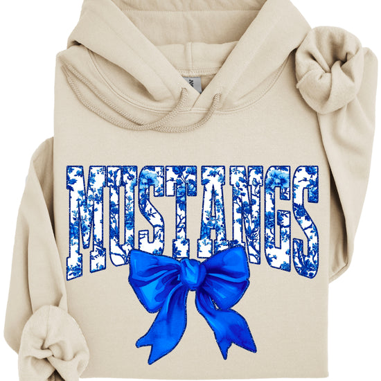 Mustangs floral bow hoodie for women in sand, varsity MUSTANGS letters with blue and white floral print and royal blue bow, image 3