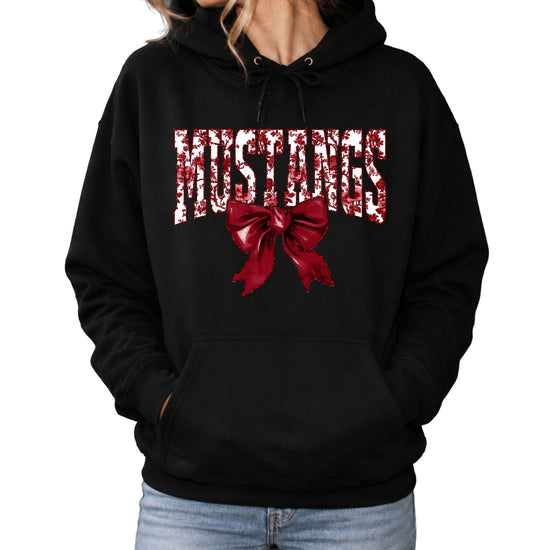 Mustangs floral bow hoodie for women in black, varsity MUSTANGS letters with maroon and white floral print and maroon bow, image 1