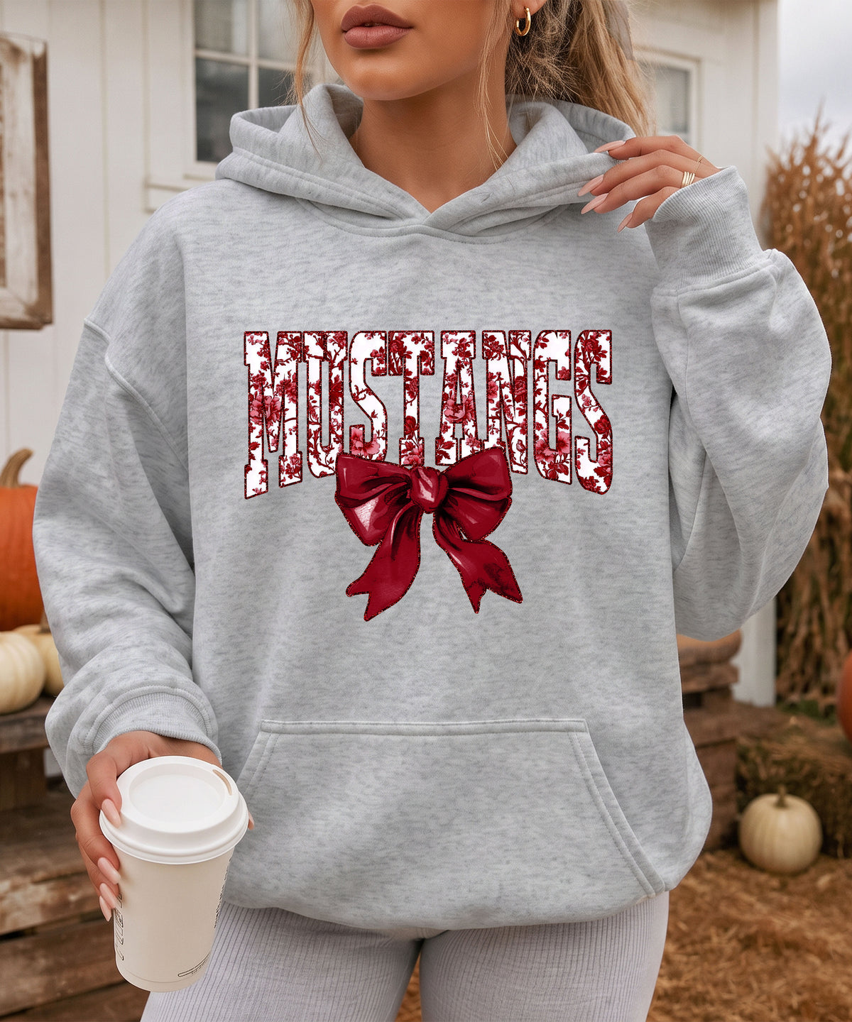 Mustangs floral bow hoodie for women in gray, varsity MUSTANGS letters with maroon and white floral print and maroon bow, image 4