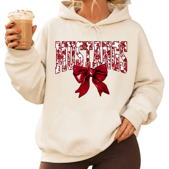 Mustangs floral bow hoodie for women in sand, varsity MUSTANGS letters with maroon and white floral print and maroon bow, image 1