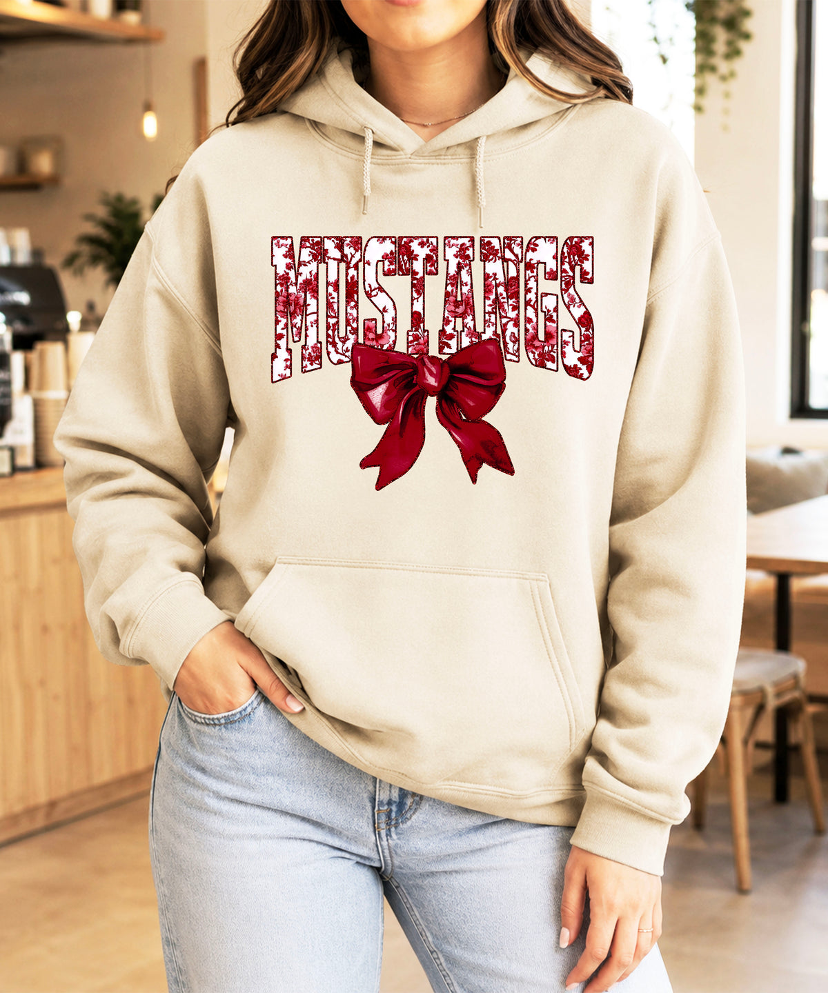 Mustangs floral bow hoodie for women in sand, varsity MUSTANGS letters with maroon and white floral print and maroon bow, image 4