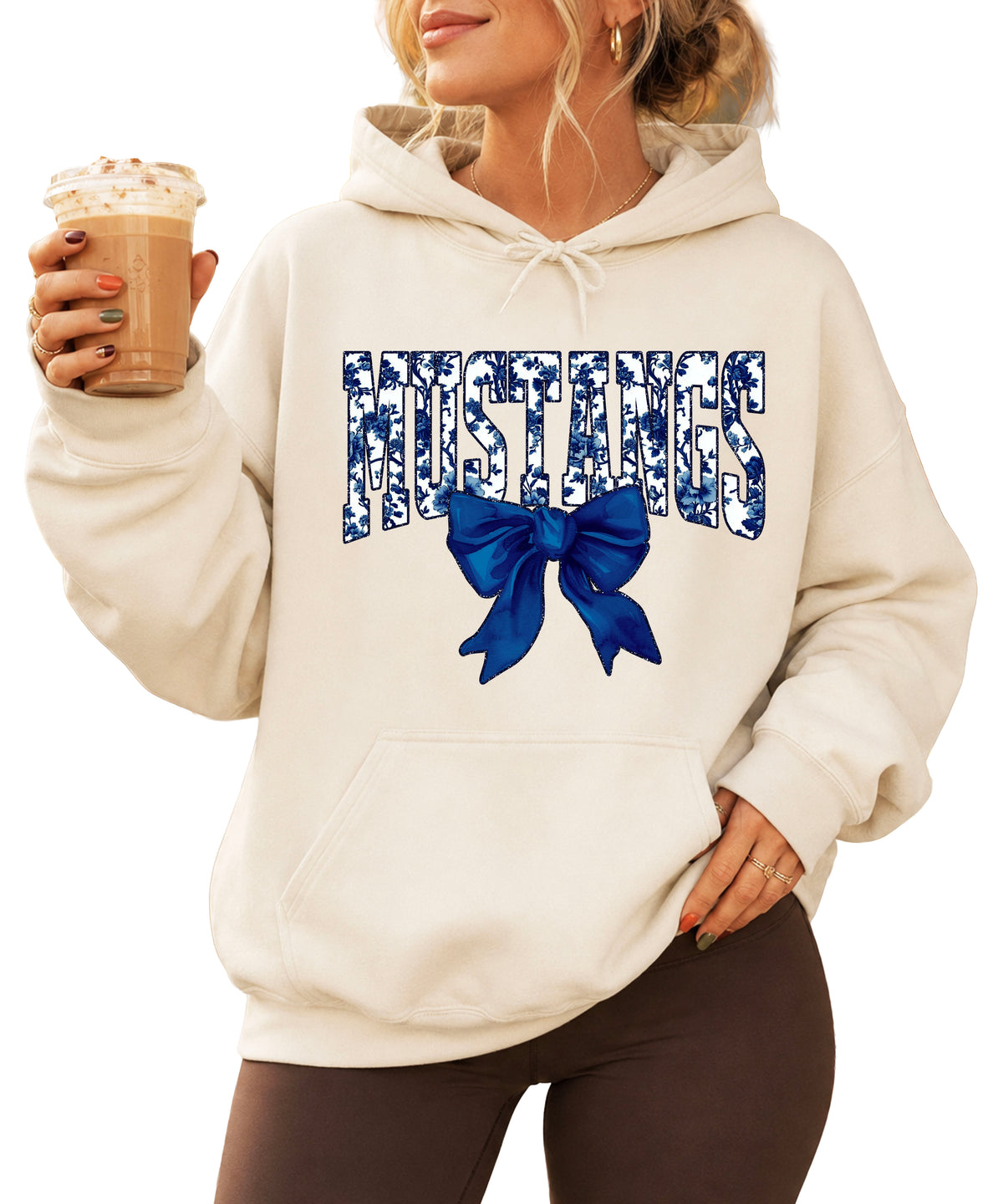 Mustangs floral bow hoodie for women in sand, varsity MUSTANGS letters with navy and white floral print and navy bow, image 1