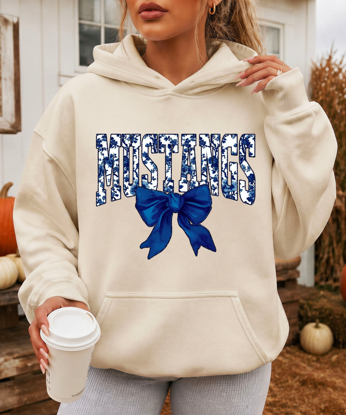 Mustangs floral bow hoodie for women in sand, varsity MUSTANGS letters with navy and white floral print and navy bow, image 4