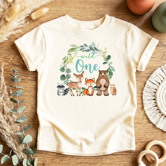 Natural Wild One wreath first birthday tee flat lay front view