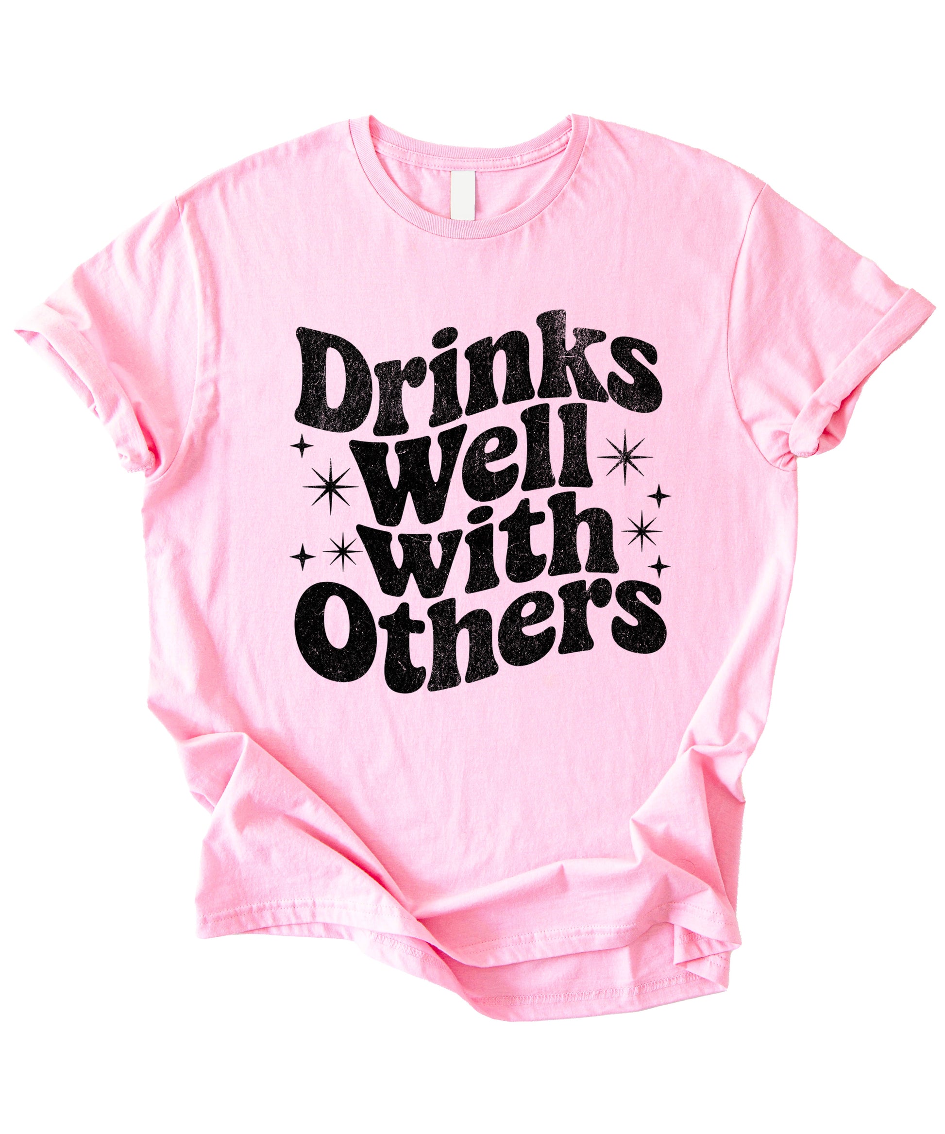 Drinks Well With Others funny graphic tee for women in Pink, lifestyle view