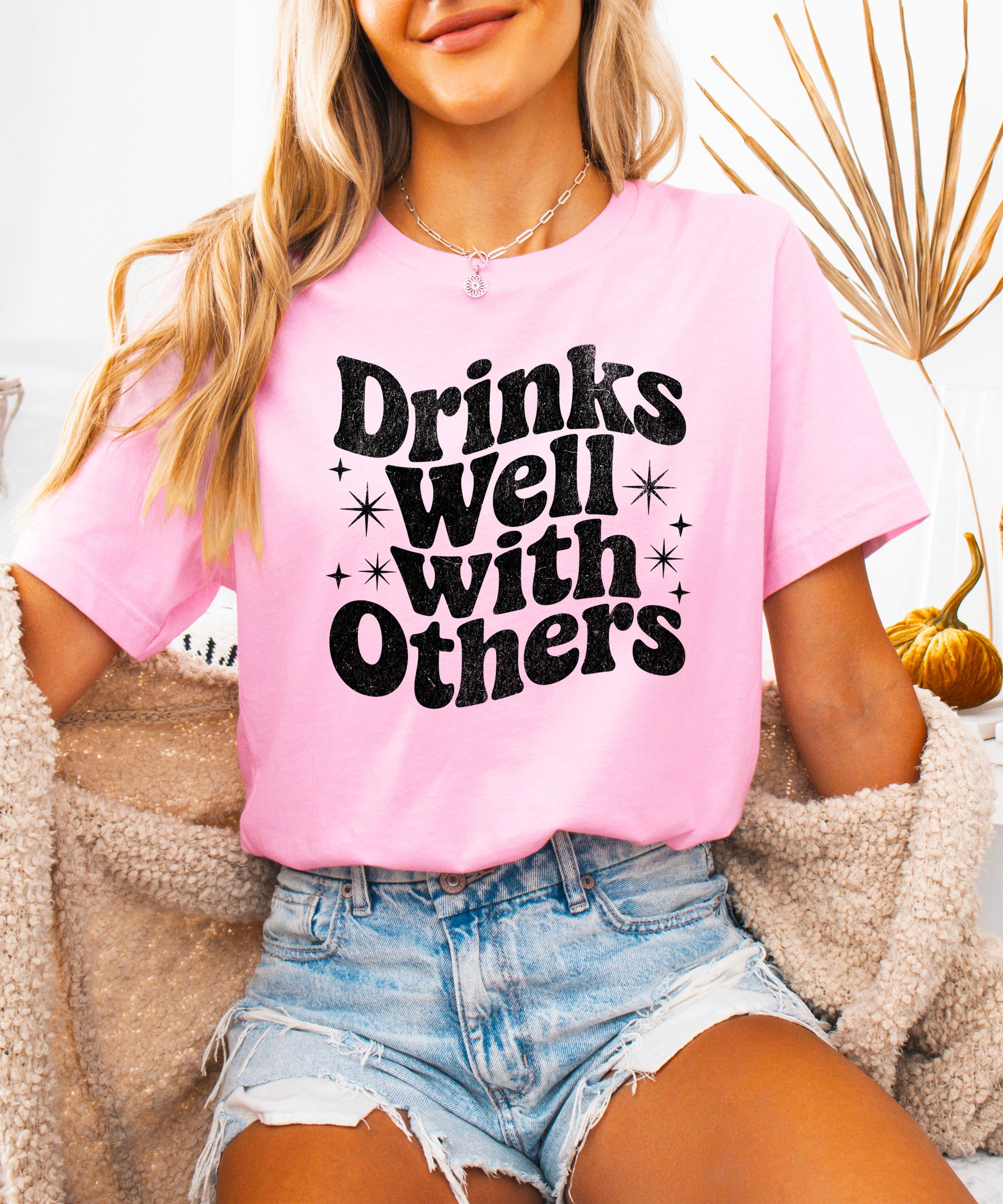 Drinks Well With Others funny graphic tee for women in Pink, detail view