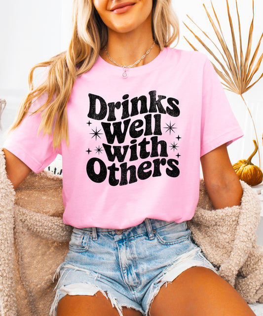 Drinks Well With Others funny graphic tee for women in Pink, detail view