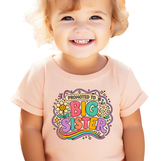 Promoted to Big Sister daisy rainbow girls tee in Peach by Olive Loves Apple (view 3)