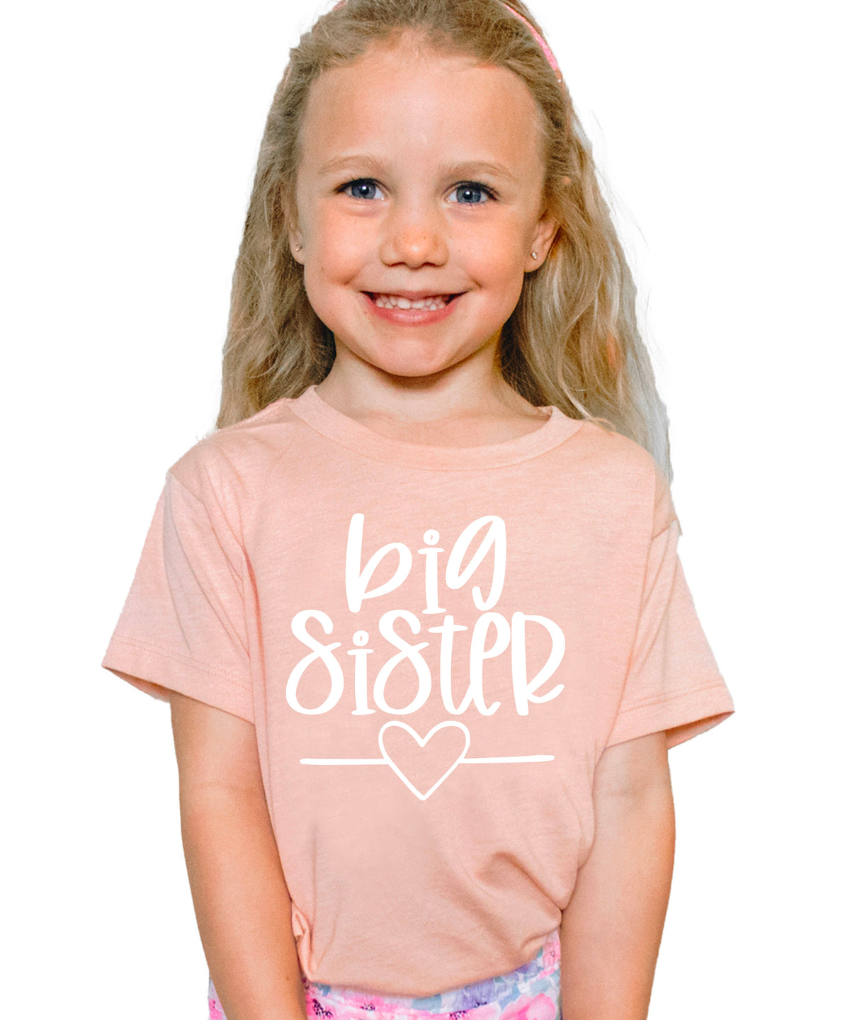 Big Sister heart sibling reveal t-shirt in white on peach, main view