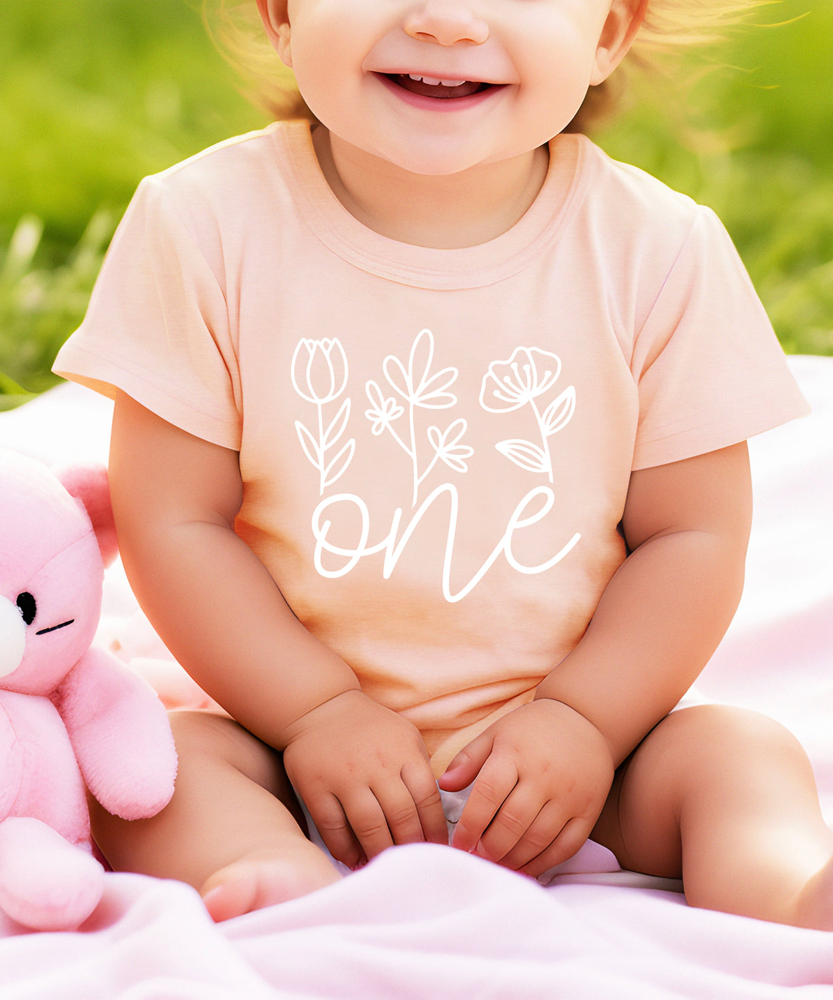 Floral One first birthday shirt for baby girls in white on peach, fourth view