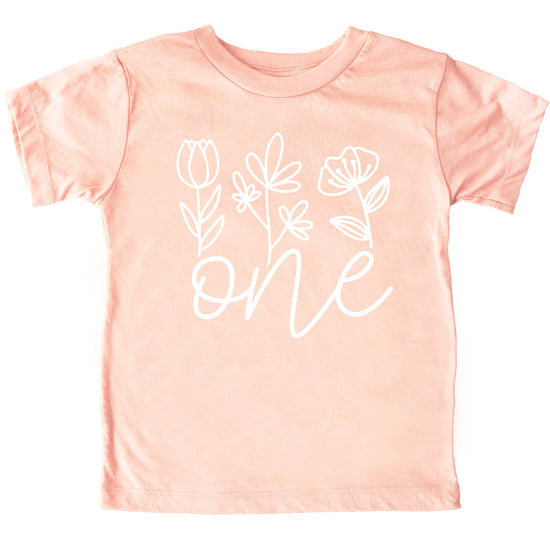 Floral One first birthday shirt for baby girls in white on peach, second view