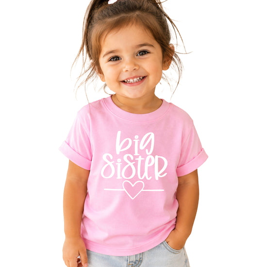 Big Sister heart sibling reveal t-shirt in white on pink, main view
