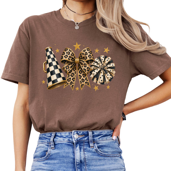 Espresso Comfort Colors 1717 cheer t-shirt with checkered megaphone, leopard print bow and polka dot pom pom graphic, front view