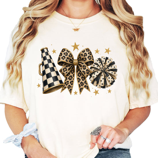 Ivory Comfort Colors 1717 cheer t-shirt with checkered megaphone, leopard print bow and polka dot pom pom graphic, front view