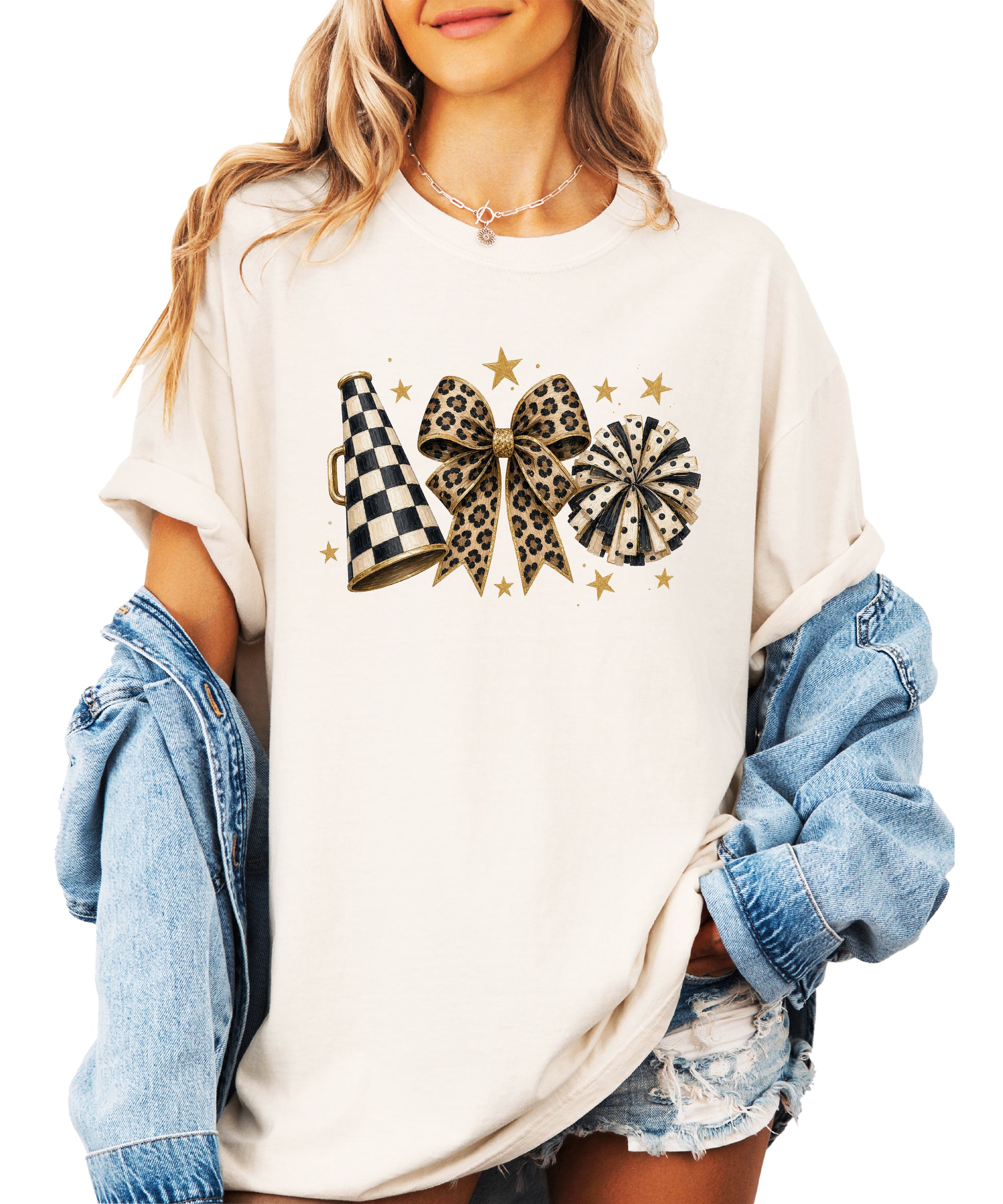 Ivory Comfort Colors 1717 cheer t-shirt with checkered megaphone, leopard print bow and polka dot pom pom graphic, styled view