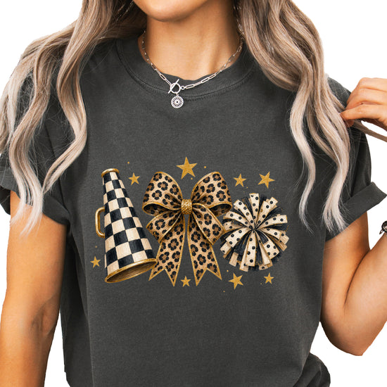 Pepper Comfort Colors 1717 cheer t-shirt with checkered megaphone, leopard print bow and polka dot pom pom graphic, styled view
