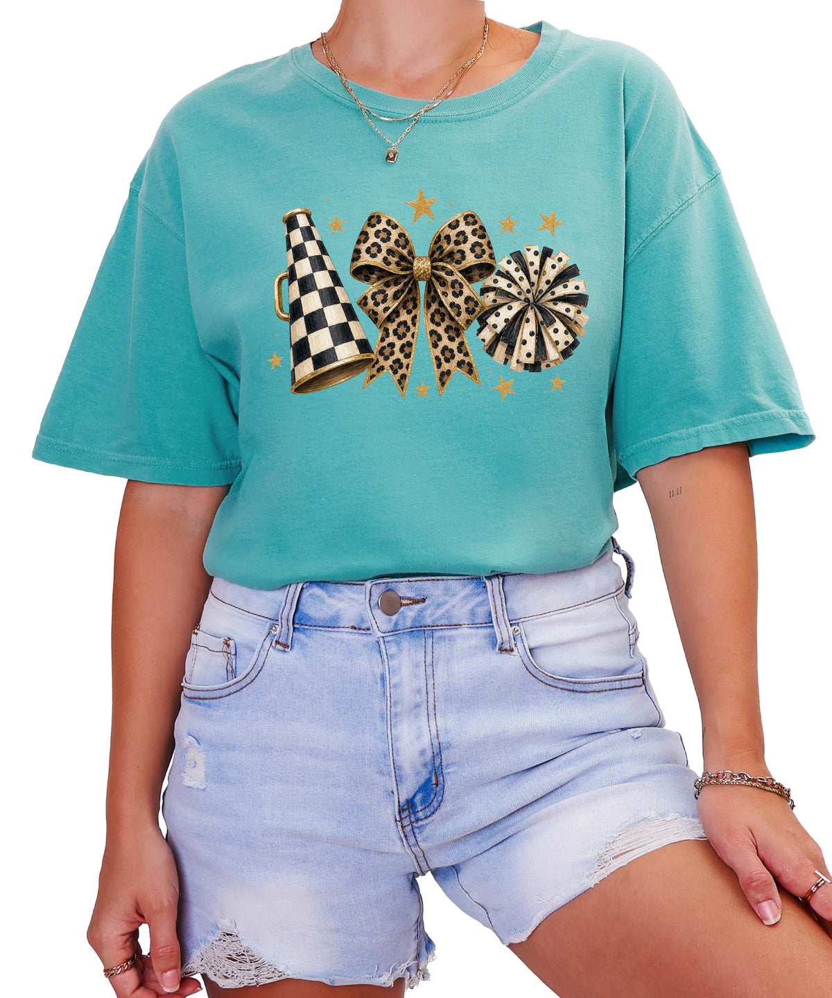 Seafoam Comfort Colors 1717 cheer t-shirt with checkered megaphone, leopard print bow and polka dot pom pom graphic, styled view