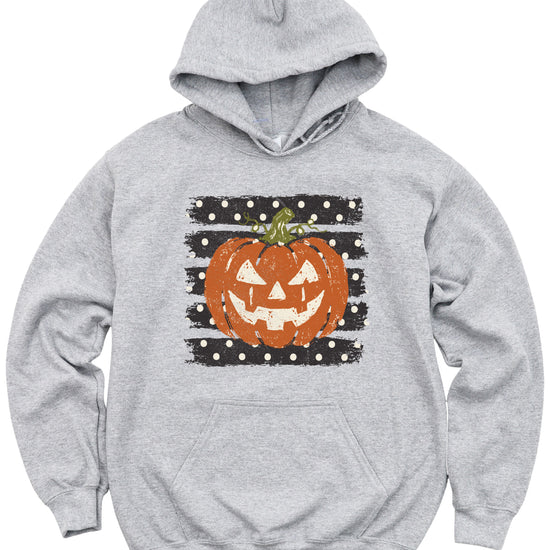 Gray hoodie with retro polka dot jack o lantern pumpkin graphic, close-up of the graphic